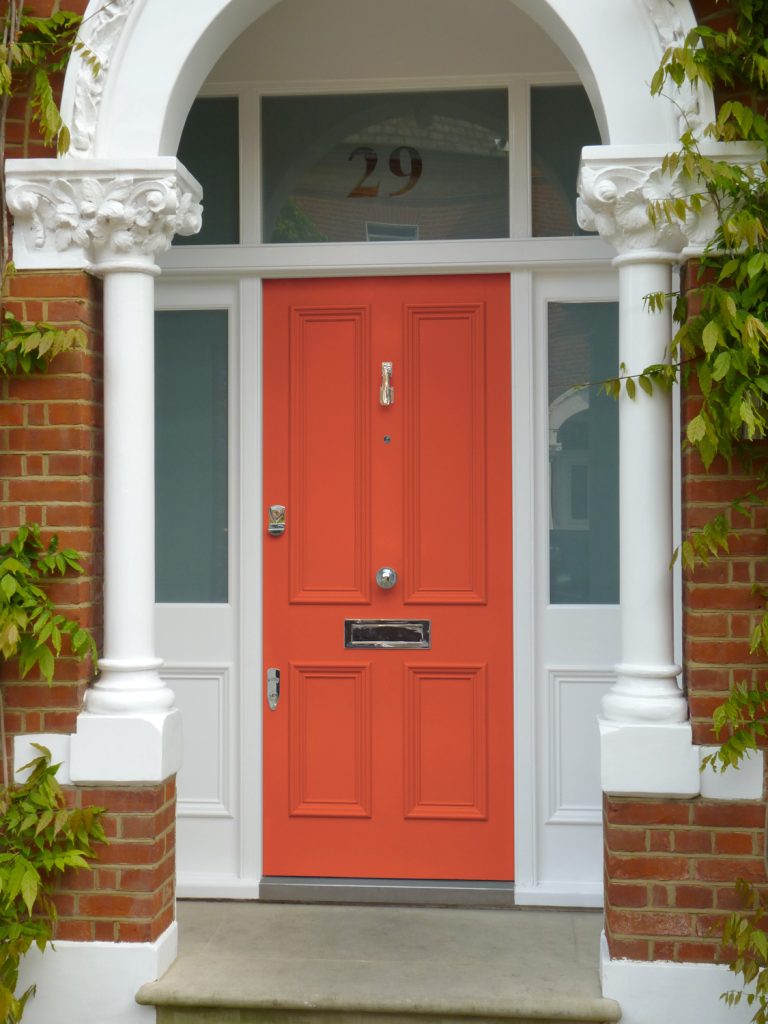 Orange Victorian door with silver hardware